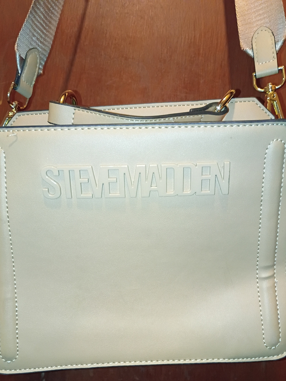 Steve Madden Cream Crossbody Tote with Embossed Logo and Gold Hardware